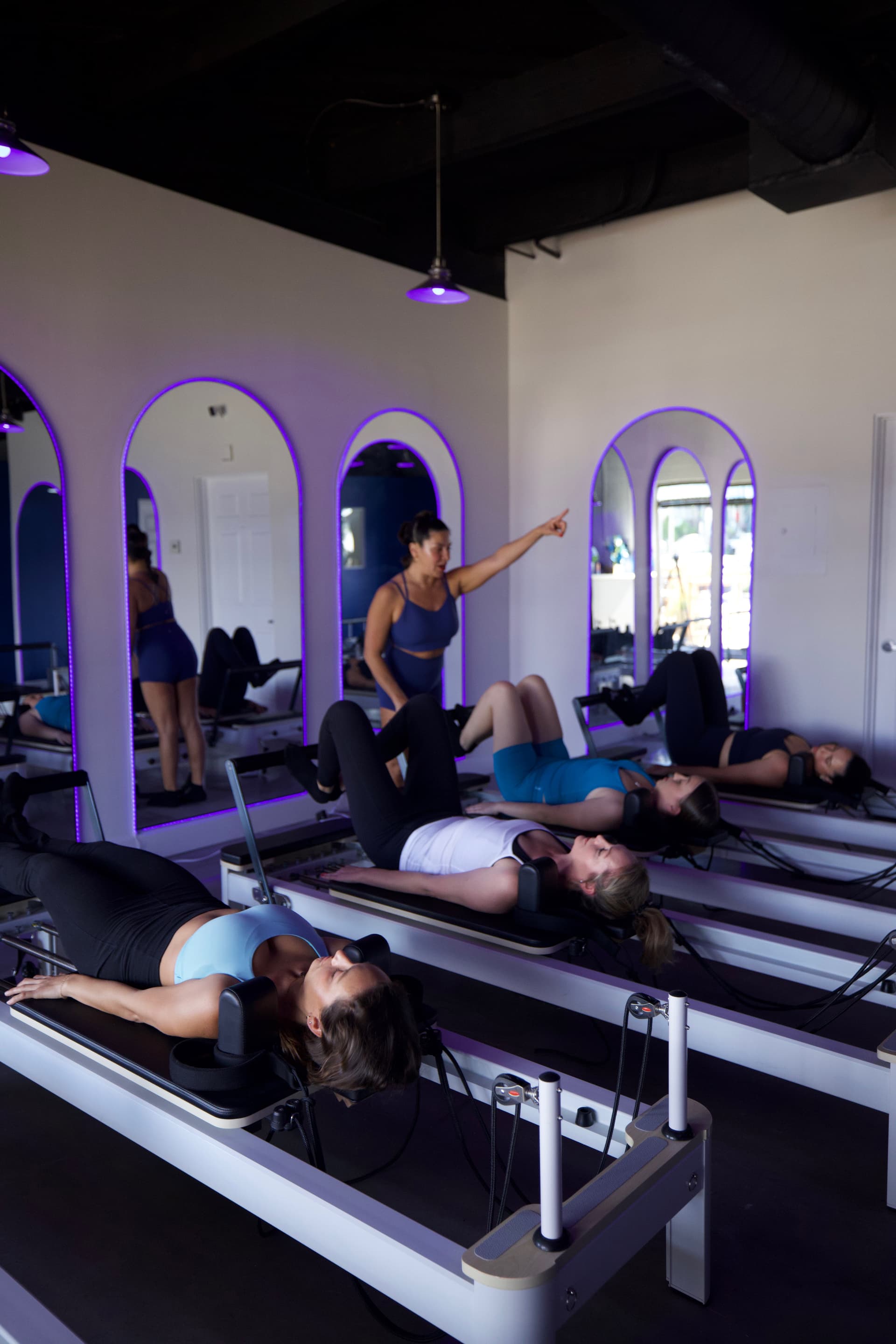 Reformer Pilates session demonstrating controlled movement